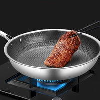 Stainless steel frying pan with non-stick coating for effortless cooking