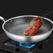 Stainless steel frying pan with non-stick coating for effortless cooking